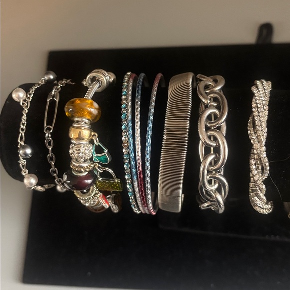 Lot of silvertone bracelets.2 are stretchy and some have adjustable chains. - Picture 5 of 5